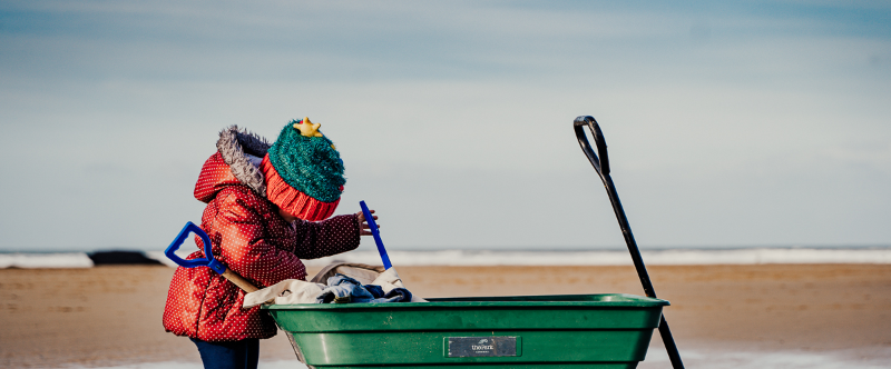 Kids on beach Christmas and wagon